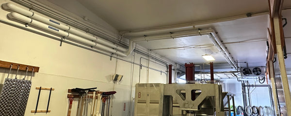Glycol lines routed through a processing facility ceiling